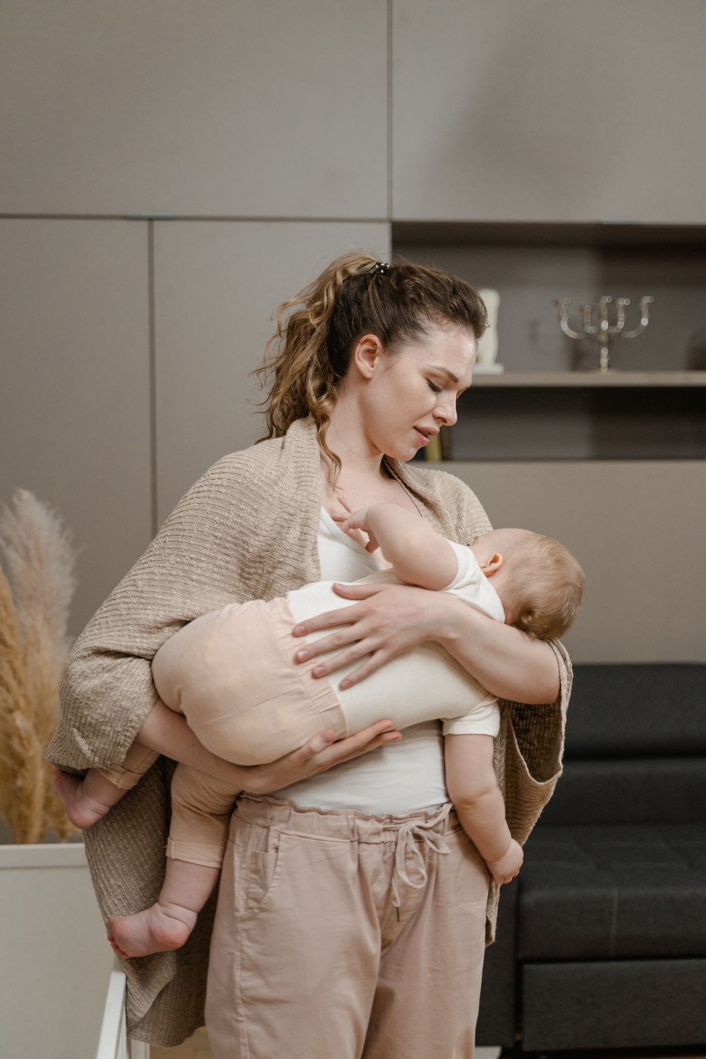 A mother cradling her baby