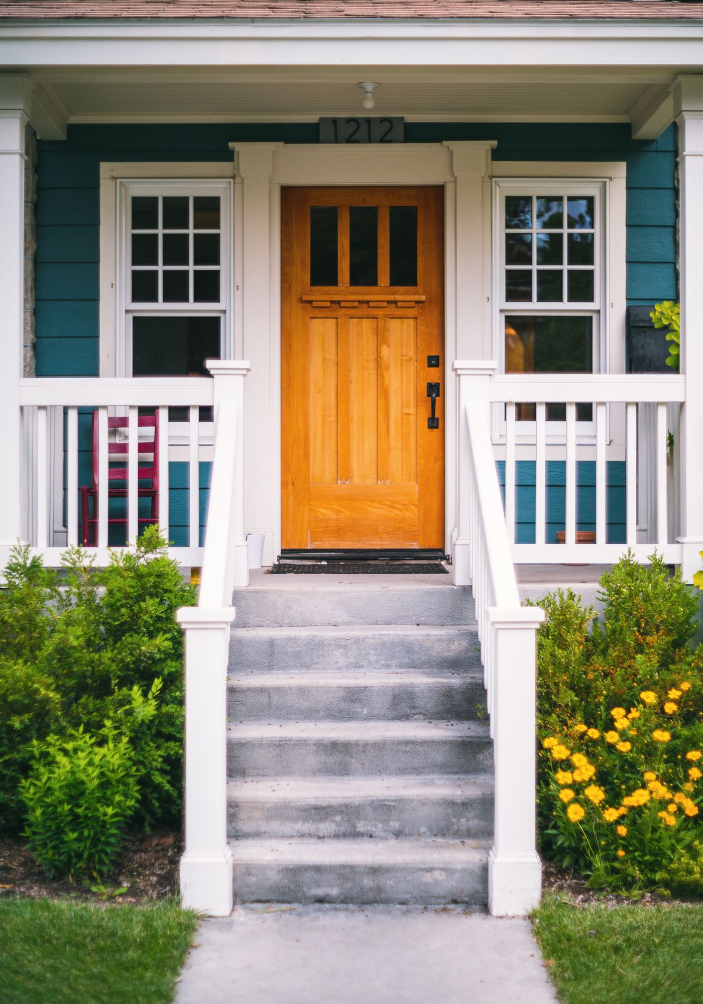A front porch with flowers
